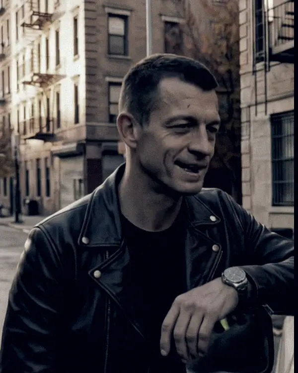 Leo, in a black leather jacket